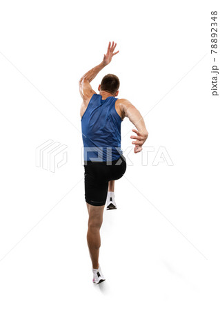 Caucasian professional male athlete, runner training isolated on white studio background. Muscular, sportive man. Concept of action, motion, youth, healthy lifestyle. Copyspace for ad. 78892348