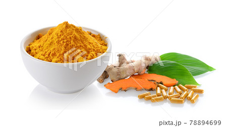 turmeric and capsules on white background turmeric and capsules on white background 78894699