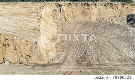 Aerial view of the steep high slope of a sand pit in Germany, abstract 78896528
