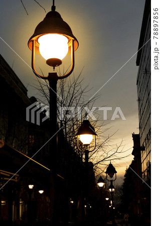 Street lamp in the evening casting light 78897856