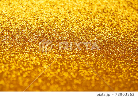 Abstract shiny blurred yellow background. Textured glittering backdrop 78903562