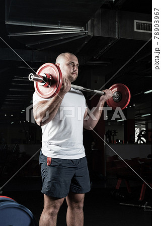 Male athlete lifts the barbell Male athlete lifts the barbell 78903967