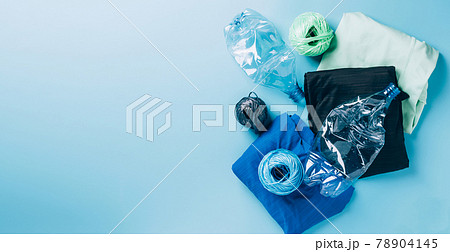 Polyester fiber synthetic fabrics eco-friendly textile recycled recyclable plastic bottles. Reuse recycling used bottles Polyester fiber synthetic fabrics eco-friendly textile recycled recyclable plastic bottles. Reuse recycling used bottles 78904145