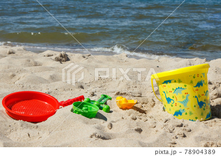 Children toys for relax or playing on sand at beach. Vacation time Children toys for relax or playing on sand at beach. Vacation time 78904389