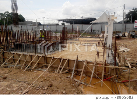 SELANGOR, SEPTEMBER 17, 2015: Building ground beam reinforcement bar and form work fabricated at site by construction workers. Concrete will be four into it after satisfied by engineer.  78905082