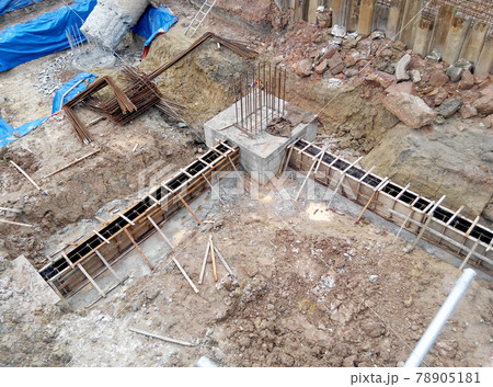 SELANGOR, SEPTEMBER 17, 2015: Building ground beam reinforcement bar and form work fabricated at site by construction workers. Concrete will be four into it after satisfied by engineer.  78905181