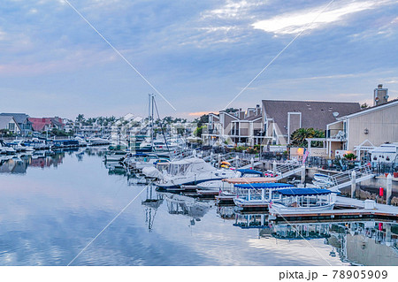 Brilliant scenery at the serene harbor of Huntington Beach California at sunset 78905909