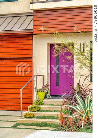Purple front door and stairs at the facade of home in Long Beach California Purple front door and stairs at the facade of home in Long Beach California 78906019