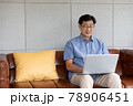 asian senior man using computer laptop at home 78906451