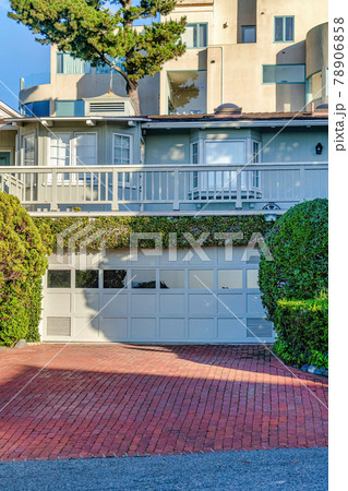 Bay windows and balcony over garage with glass paned white door in San Diego Bay windows and balcony over garage with glass paned white door in San Diego 78906858