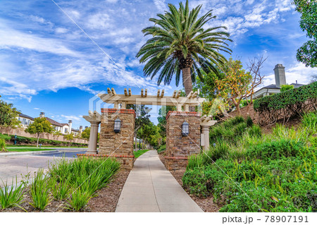 Road pathway and gate at the entrance of neighborhood in Huntington Beach CA Road pathway and gate at the entrance of neighborhood in Huntington Beach CA 78907191