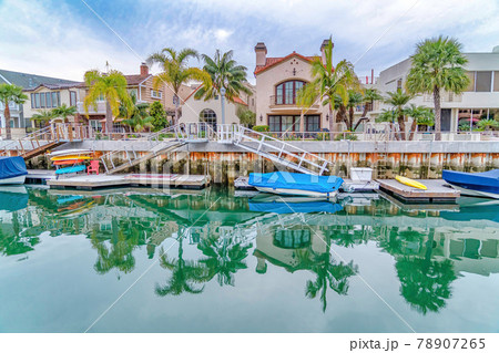 Spectacular view of canal with boats and docks in the neighborhood of Long Beach 78907265