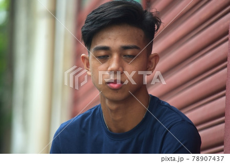 A Tired  Filipino Teenage Boy 78907437