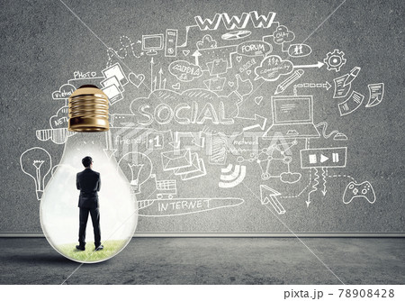 Businessman trapped in bulb Businessman trapped in bulb 78908428