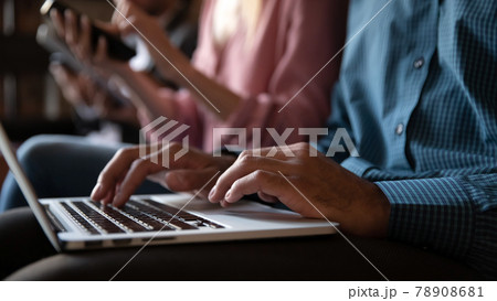 Close up unrecognizable young african man typing on laptop. Close up unrecognizable young african man typing on laptop. 78908681