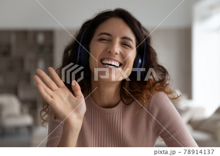 Portrait of smiling Hispanic woman talk on webcam call 78914137