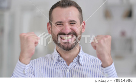 Portrait of Ambitious Young Man Celebrating Success 78914986