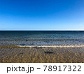 Sand beach, sea water waves and beautiful blue sky at Brighton beach in Melbourne, Australia. 78917322