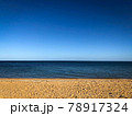 Sand beach, sea water waves and beautiful blue sky at Brighton beach in Melbourne, Australia. 78917324