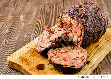 Closeup view of baked with vegetables beef roll Closeup view of baked with vegetables beef roll 78921707