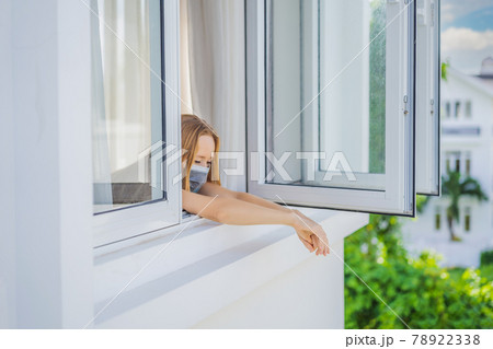 Extremly tired woman looking out the window, home alone. self-isolation at home, quarantine due to pandemic COVID 19. Mental health problems in self-isolation at home, quarantine, isolation, stay at Extremly tired woman looking out the window, home alone. self-isolation at home, quarantine due to pandemic COVID 19. Mental health problems in self-isolation at home, quarantine, isolation, stay at 78922338