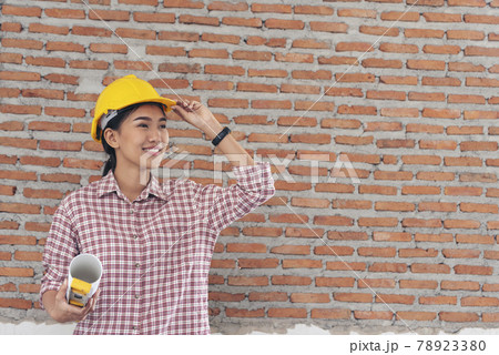 Woman construction engineer wear safety white hard hat at construction site industry worker. Female engineer worker civil engineering with hard hat safety helmet. Woman construction Engineer concept 78923380