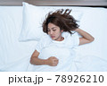 Young Woman Sleeping Cozily 78926210