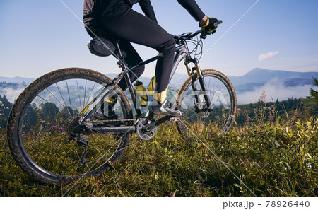 Young man riding a mountain bike downhill style 78926440