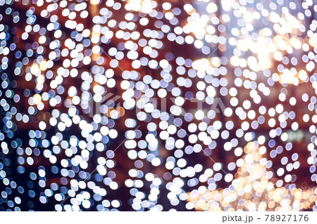 Blurry garlands with bokeh. Christmas lights in the windows Blurry garlands with bokeh. Christmas lights in the windows 78927176