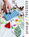 Phone case with pop it on white wooden background 78928039