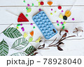 Phone case with pop it on white wooden background 78928040