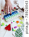 Phone case with pop it on white wooden background 78928043