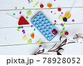 Phone case with pop it on white wooden background 78928052