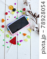 Phone case with pop it on white wooden background 78928054
