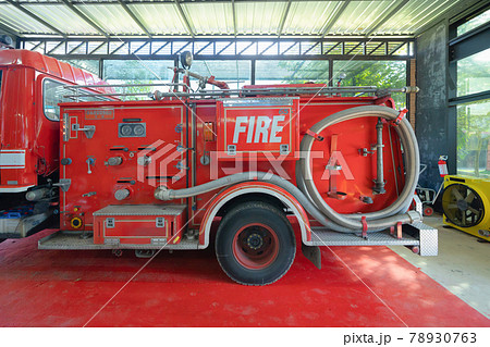 A fire truck car or firefighting apparatus parking at fire station, an emergency accident rescue vehicle transportation in station. Ambulance. Service. A fire truck car or firefighting apparatus parking at fire station, an emergency accident rescue vehicle transportation in station. Ambulance. Service. 78930763