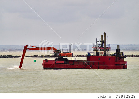 An excavator on a dredging ship 78932828