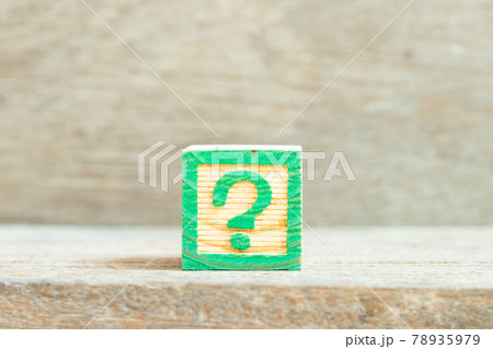Color alphabet letter block in word question mark on wood background Color alphabet letter block in word question mark on wood background 78935979