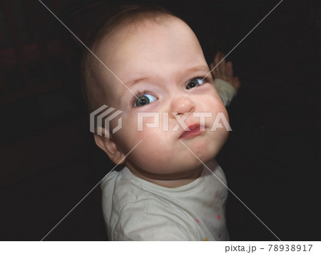 Portrait of a cute little child who is offended or angry Portrait of a cute little child who is offended or angry 78938917