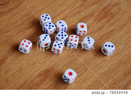 White dice put randomly on wood texture background. White dice put randomly on wood texture background. 78939458