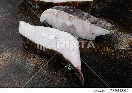 Halibut fish frozen steak, on old dark rustic table background, with copy space for text 78941309