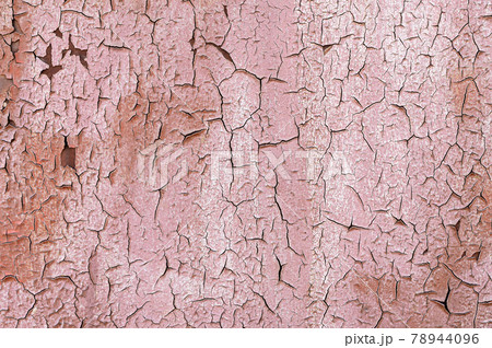 Pink Old flaky paint on a metal surface. Red grunge texture 78944096