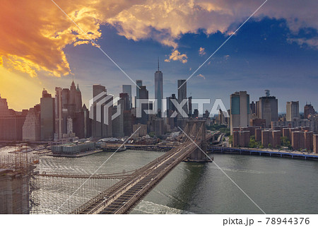 Brooklyn Bridge at sunset view on New York City Manhattan skyline panorama with skyscrapers over Hudson River Brooklyn Bridge at sunset view on New York City Manhattan skyline panorama with skyscrapers over Hudson River 78944376