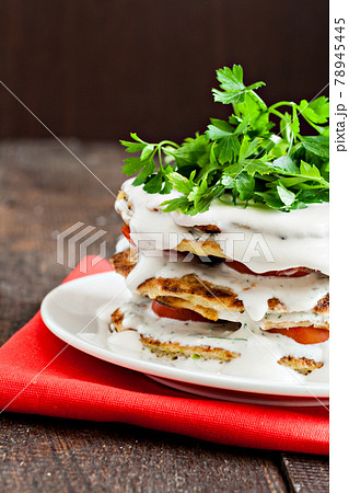 zucchini cake watered sauce on a red napkin 78945445