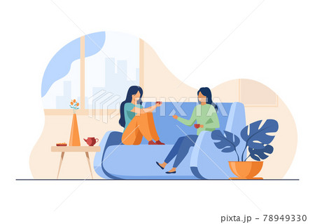 Two female friends meeting and chatting at home Two female friends meeting and chatting at home 78949330