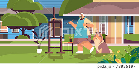 senior woman artist with dog painting picture creative hobby concept full length 78956197