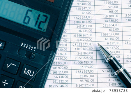 Pen with calculator on paper background with totals. Pen with calculator on paper background with totals. 78958788