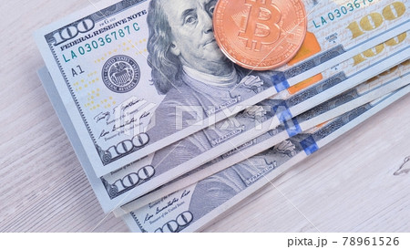 Bitcoin cryptocurrency coins on one hundred US Dollar. Virtual cryptocurrency concept. Bitcoin BTC Bitcoin cryptocurrency coins on one hundred US Dollar. Virtual cryptocurrency concept. Bitcoin BTC 78961526