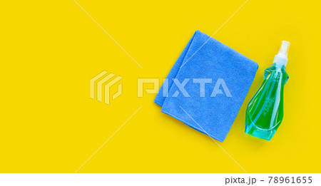 Window cleaner in plastic bottle with blue towel 78961655