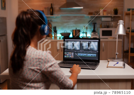Brunette video editor works with footage Brunette video editor works with footage 78965110
