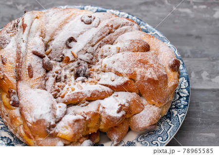 Typical Portuguese Easter Cake with dry fruits and nuts on beautiful dish Typical Portuguese Easter Cake with dry fruits and nuts on beautiful dish 78965585